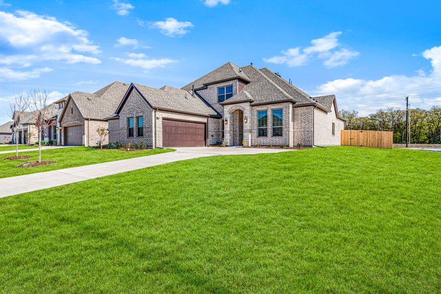 Front exterior of a new home in Forest Ridge Estates, Greenville, TX, highlighting curb appeal (Image 22). Front exterior of a new home in Forest Ridge Estates, Greenville, TX, highlighting curb appeal (Image 22).