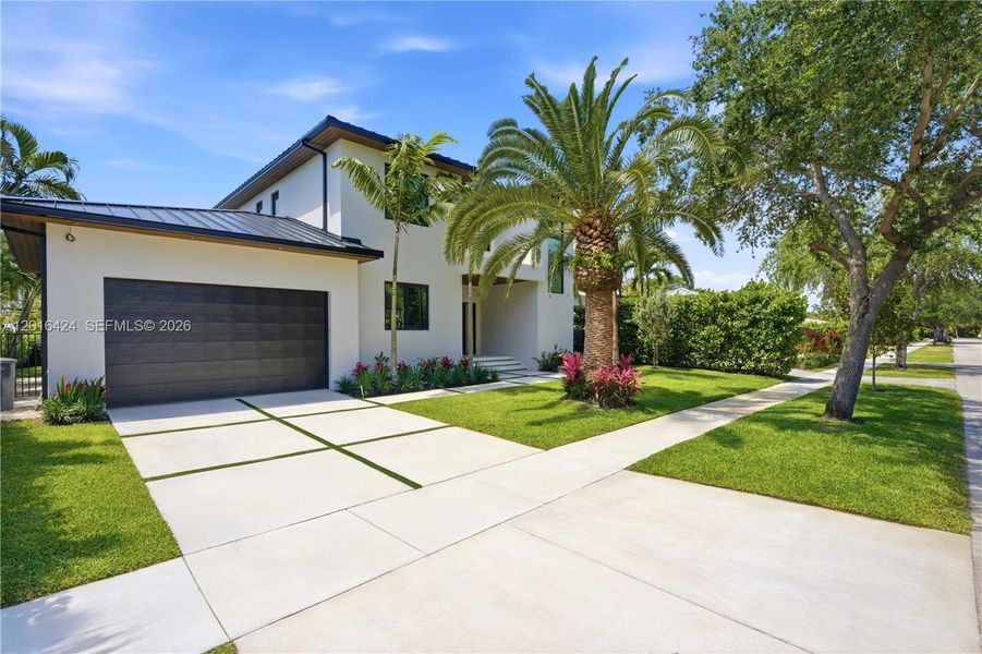 Front exterior of a new home in , North Miami, FL, highlighting curb appeal (Image 26).