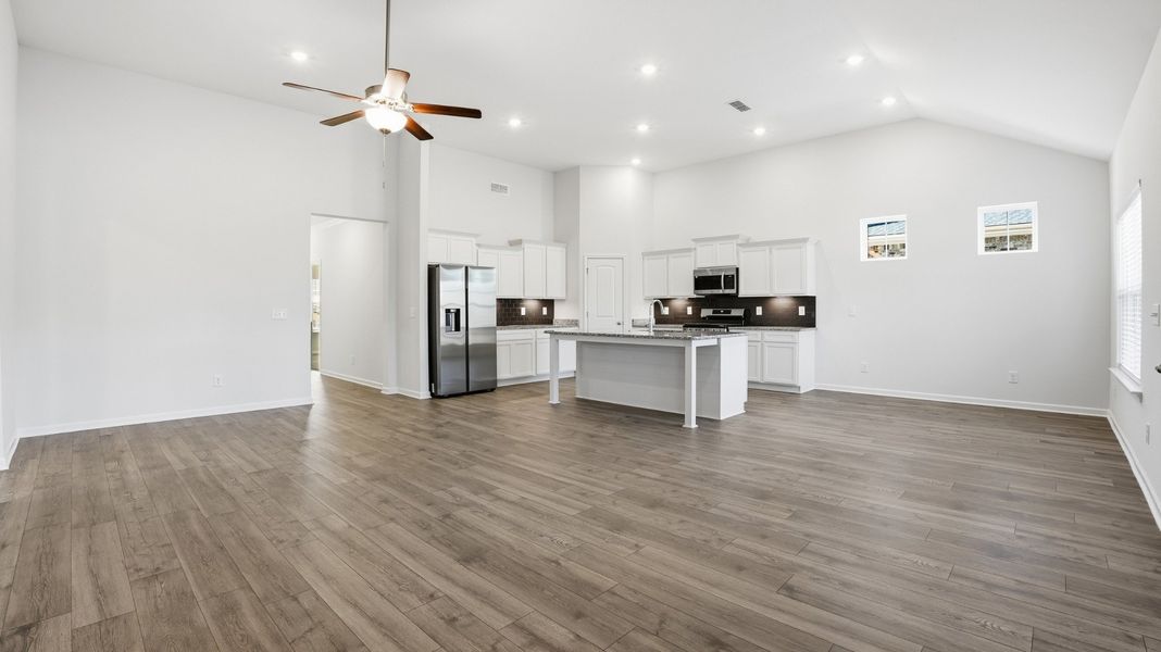 great room looking into dining room and kitchen