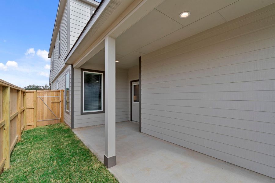 Exterior details and patio area of a home in Cypresswood Landing, Humble (Image 3).