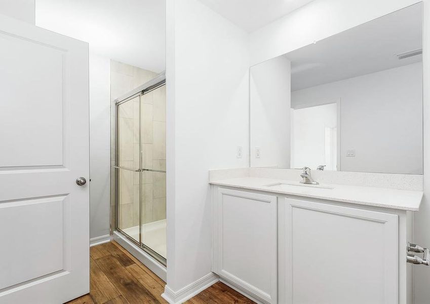 The master bathroom has a step in shower