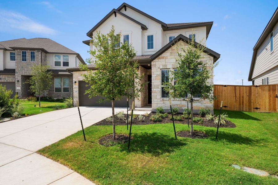 Front exterior of a new home in Park Central, Georgetown, TX, highlighting curb appeal (Image 2). Front exterior of a new home in Park Central, Georgetown, TX, highlighting curb appeal (Image 2).