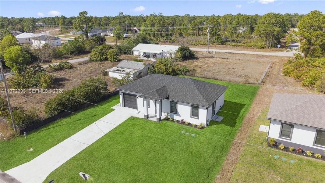 Front exterior of a new home in , Lehigh Acres, FL, highlighting curb appeal (Image 22).