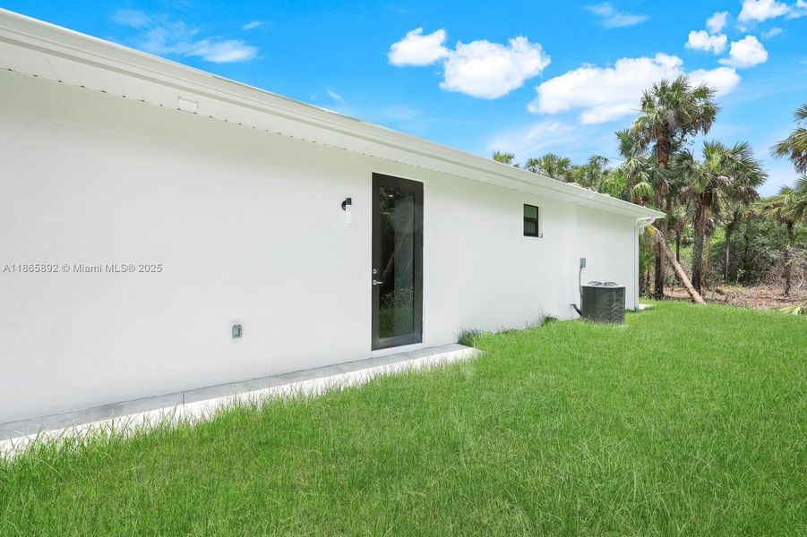 Front exterior of a new home in , Naples, FL, highlighting curb appeal (Image 2).