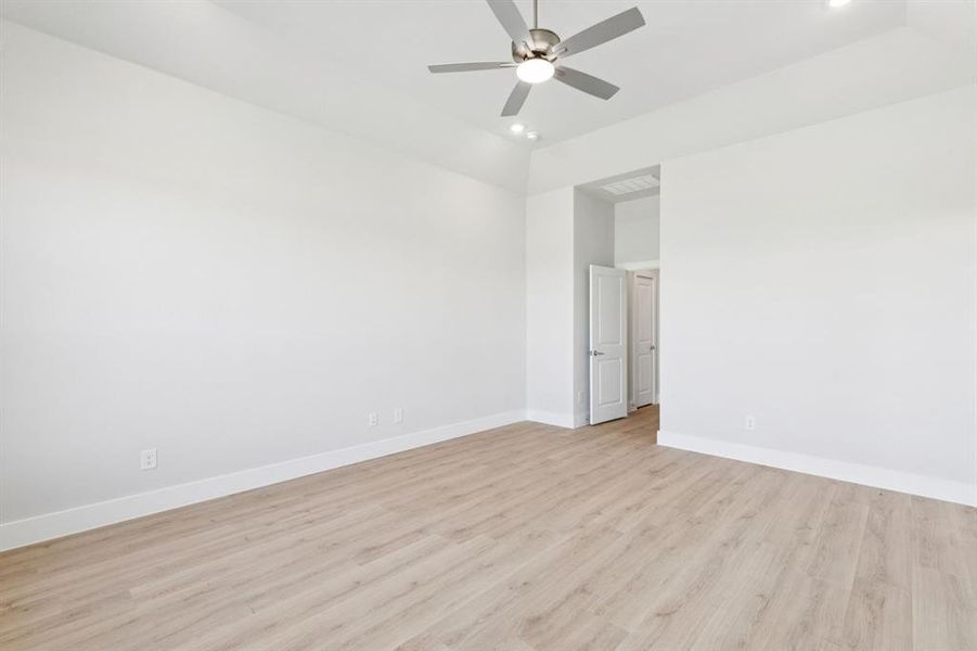 Spare room with light wood finished floors, recessed lighting, and a ceiling fan
