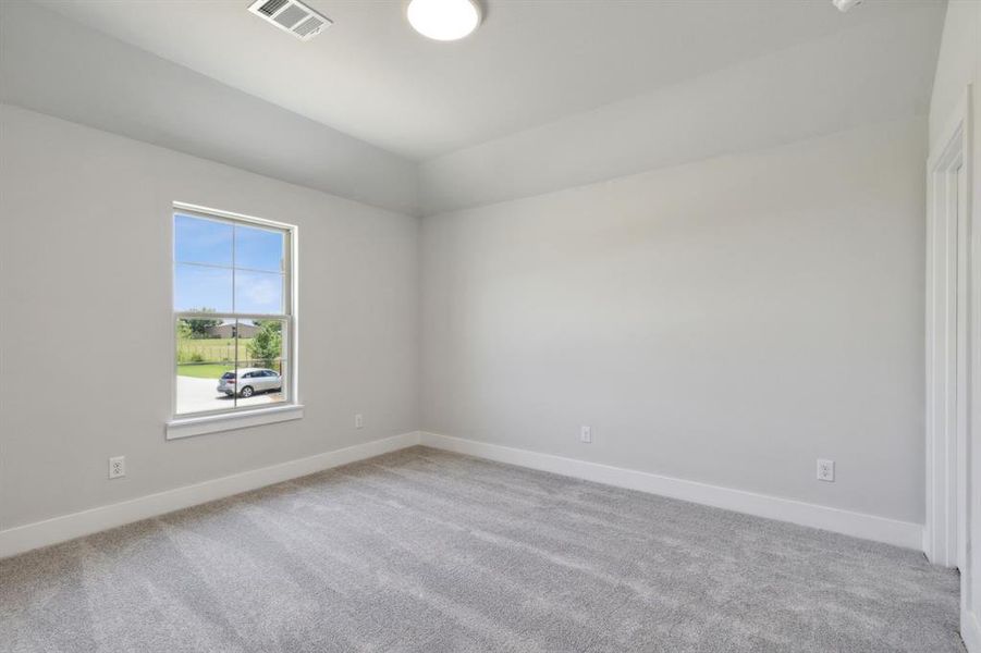 Empty room featuring carpet