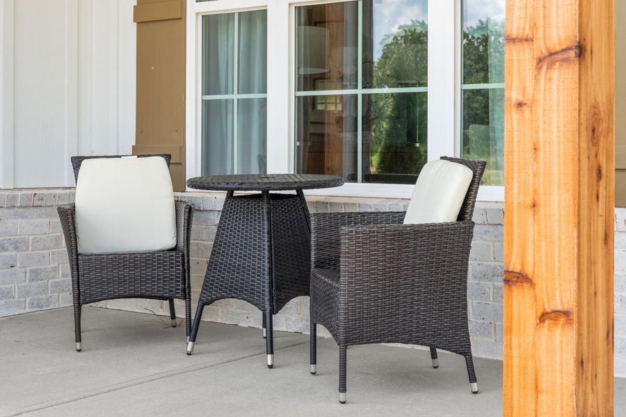 A table and chairs in a room. A table and chairs in a room.
