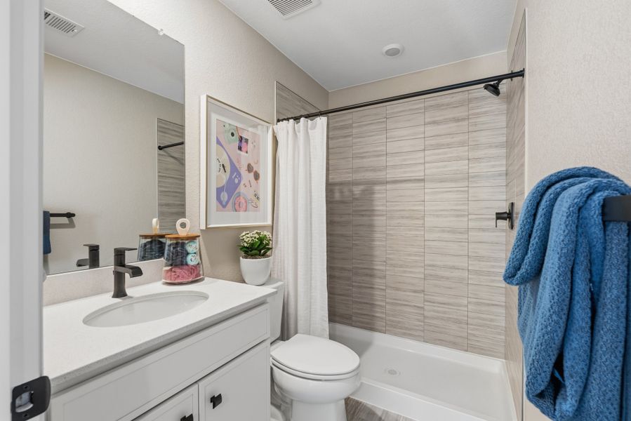 Representative furnished interior of a home built from the 4008 by Risewell Homes in Harvest Crossing, Aurora (Image 17).