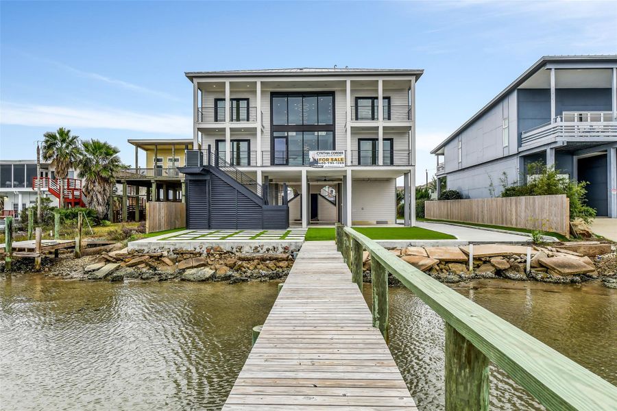Bayfront living starts at your own pier. The home's impressive waterfront elevation, private boat slip and broad bay views turn spontaneous fishing trips and sunset cruises into part of everyday life. Bayfront living starts at your own pier. The home's impressive waterfront elevation, private boat slip and broad bay views turn spontaneous fishing trips and sunset cruises into part of everyday life.