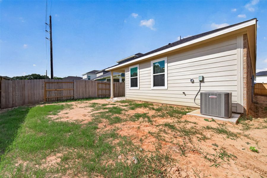 Exterior details and patio area of a home in La Segarra, Brookshire (Image 25).