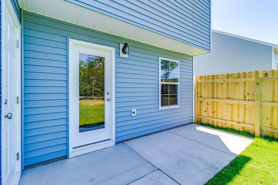 Exterior details and patio area of a home in Padgett Commons, Hopkins (Image 3).