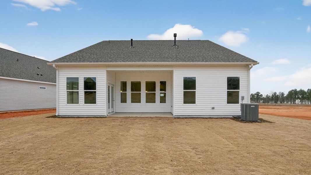 Exterior details and patio area of a home in The Villas at Galvins Ridge, Sanford (Image 3).