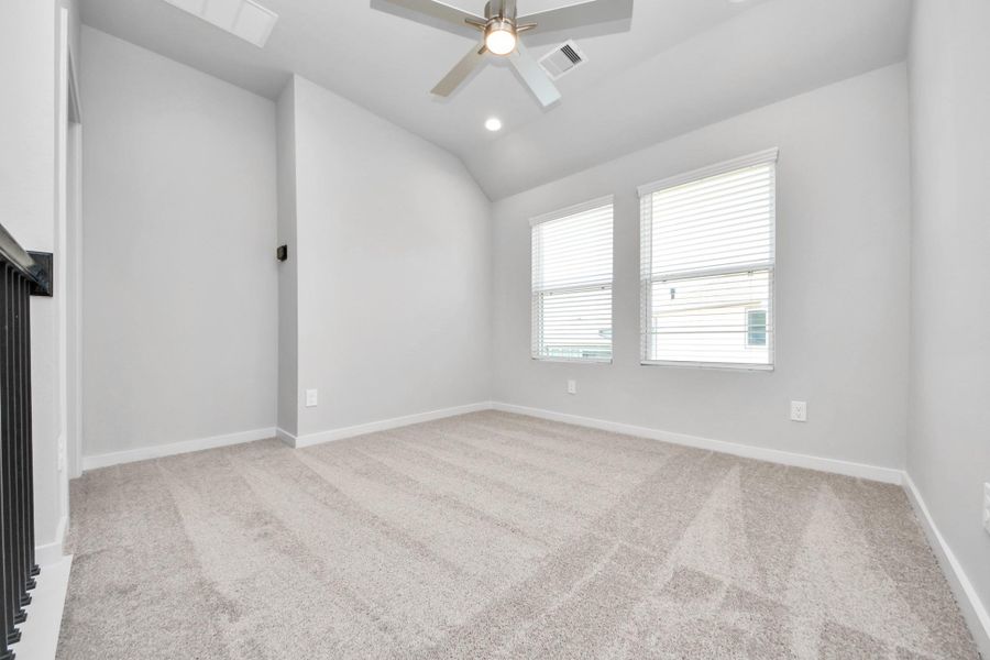 Come upstairs and relish a day of relaxation in this loft area! Ideal as an additional living space or game room, it boasts plush carpeting, high ceilings, custom paint, and windows that flood the area with abundant natural light. Sample photo of completed home with similar floor plan. Actual colors and selections may vary. Come upstairs and relish a day of relaxation in this loft area! Ideal as an additional living space or game room, it boasts plush carpeting, high ceilings, custom paint, and windows that flood the area with abundant natural light. Sample photo of completed home with similar floor plan. Actual colors and selections may vary.