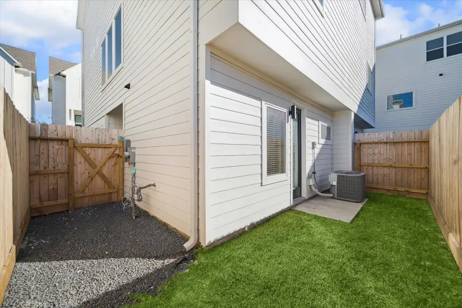 A private fenced backyard offers a manageable outdoor space perfect for relaxing or entertaining.