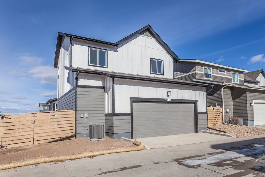 Front exterior of a new home in Trailside, Timnath, CO, highlighting curb appeal (Image 27). Front exterior of a new home in Trailside, Timnath, CO, highlighting curb appeal (Image 27).