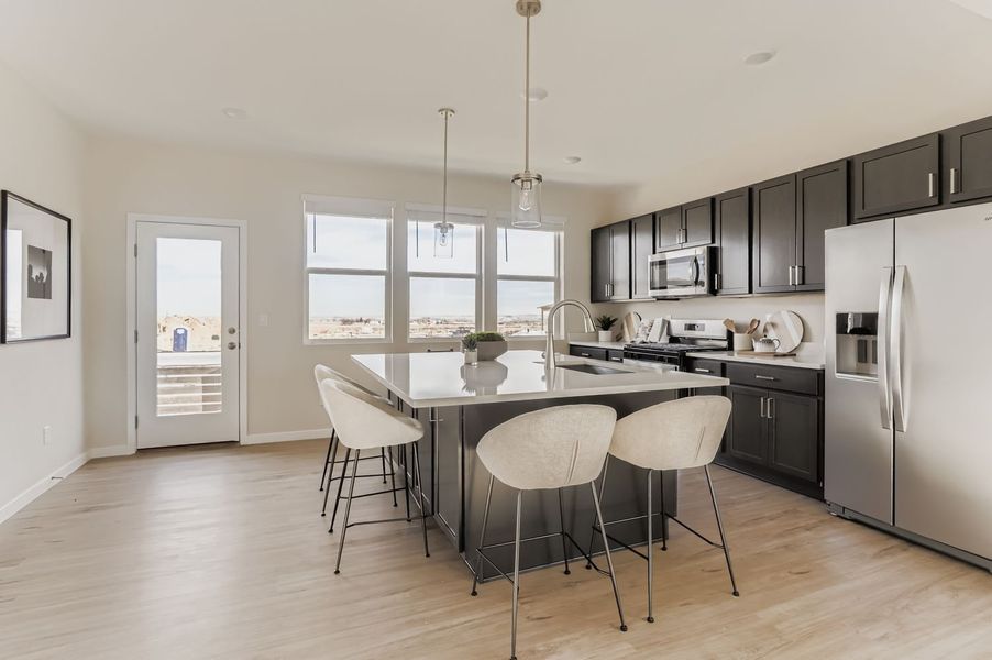 Furnished interior view inside a new home in Barefoot, Firestone (Image 3).