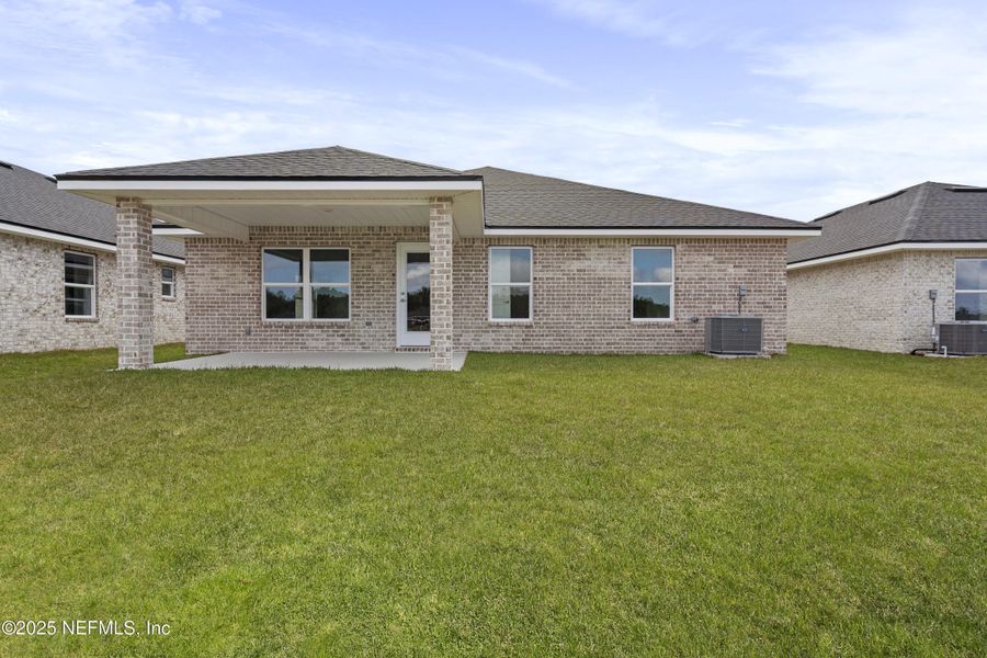 Front exterior of a new home in Shadow Crest at Rolling Hills, Green Cove Springs, FL, highlighting curb appeal (Image 14).