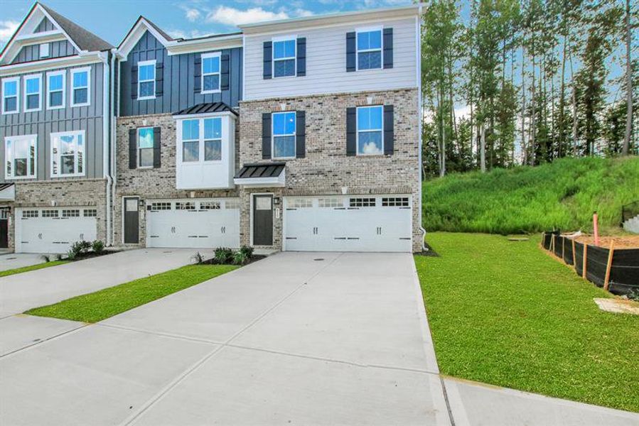 Front exterior of a new home in Park Ridge at Sugar Hill, Sugar Hill, GA, highlighting curb appeal (Image 2).
