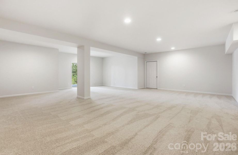 The walk-out lower level is designed for entertaining with a spacious recreation room, plus an unfinished area ready for your personal touch—whether it’s a home gym, theater, or extra storage