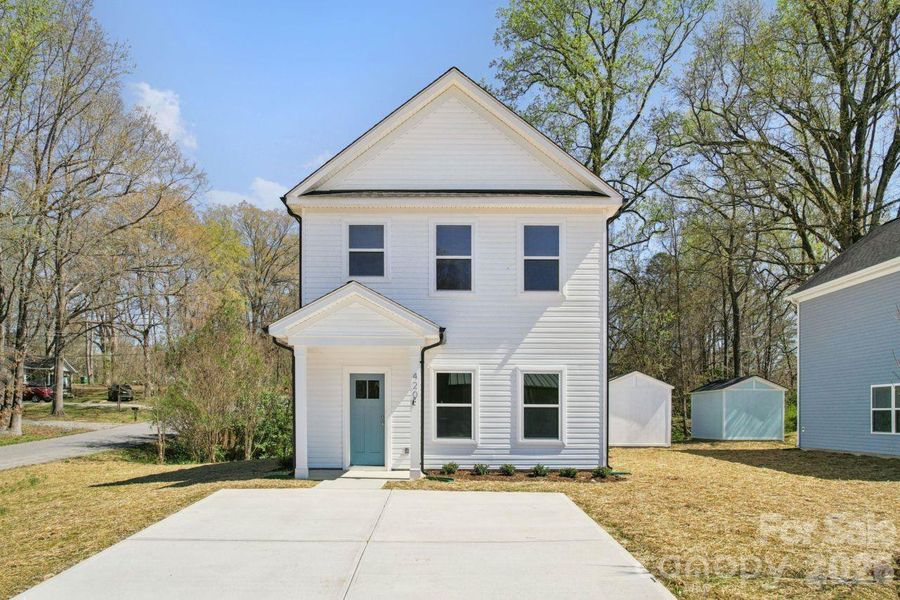Front exterior of a new home in , Bessemer City, NC, highlighting curb appeal (Image 14).