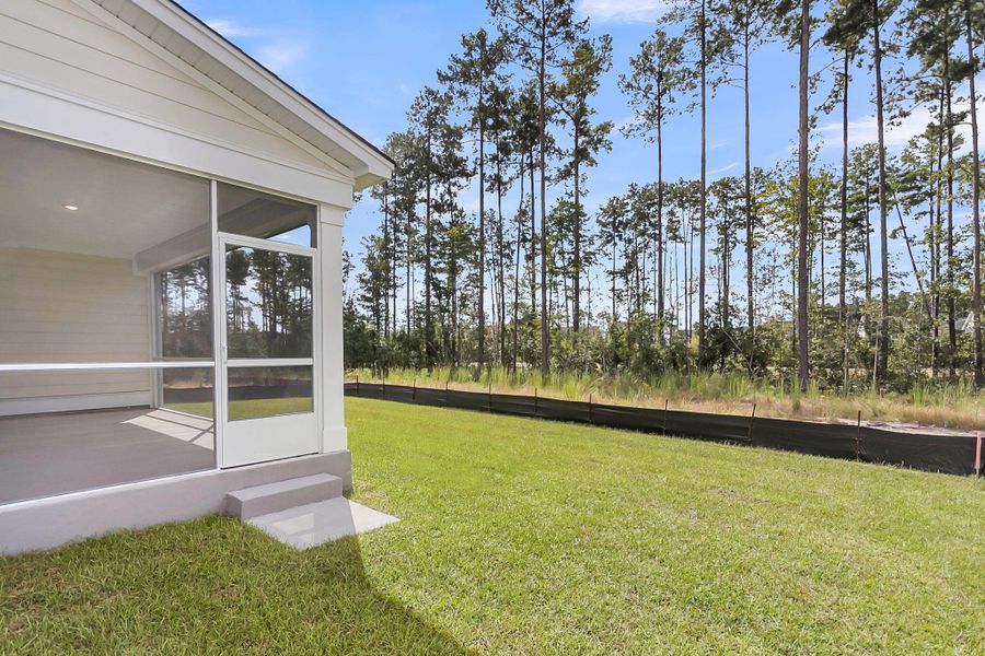 Exterior details and patio area of a home in Tidewater at Lakes of Cane Bay, Summerville (Image 18). Exterior details and patio area of a home in Tidewater at Lakes of Cane Bay, Summerville (Image 18).