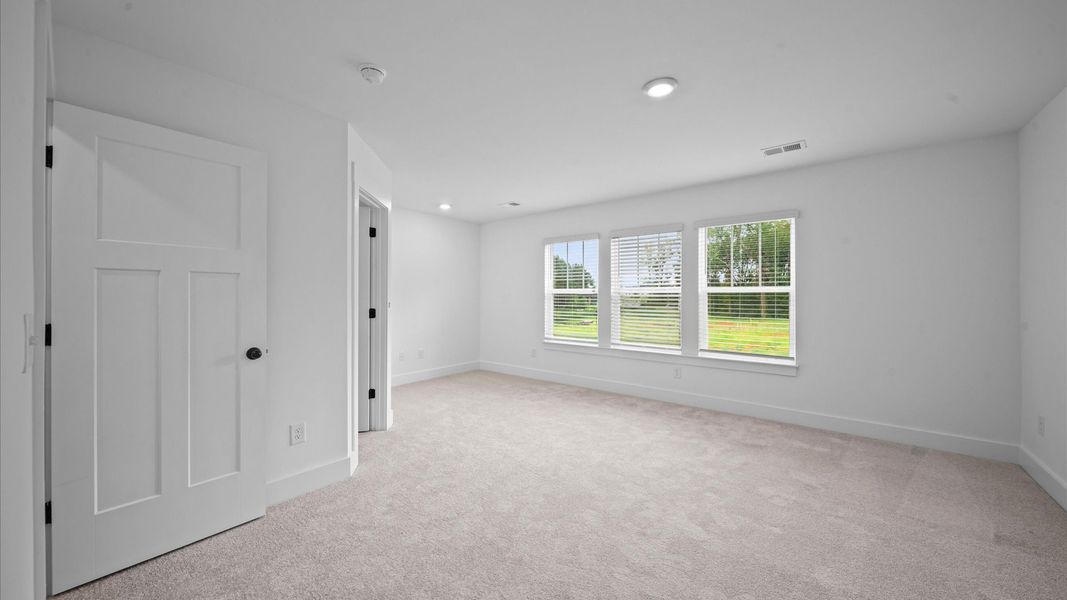 Highly skilled design shines in this elegant, restful primary suite