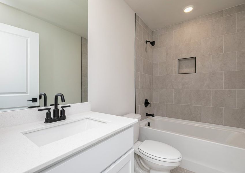 Guests can get ready for their days in the secondary bathroom