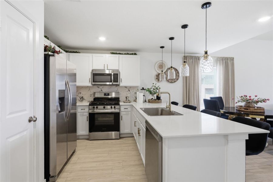 Stainless steel appliances in the kitchen.