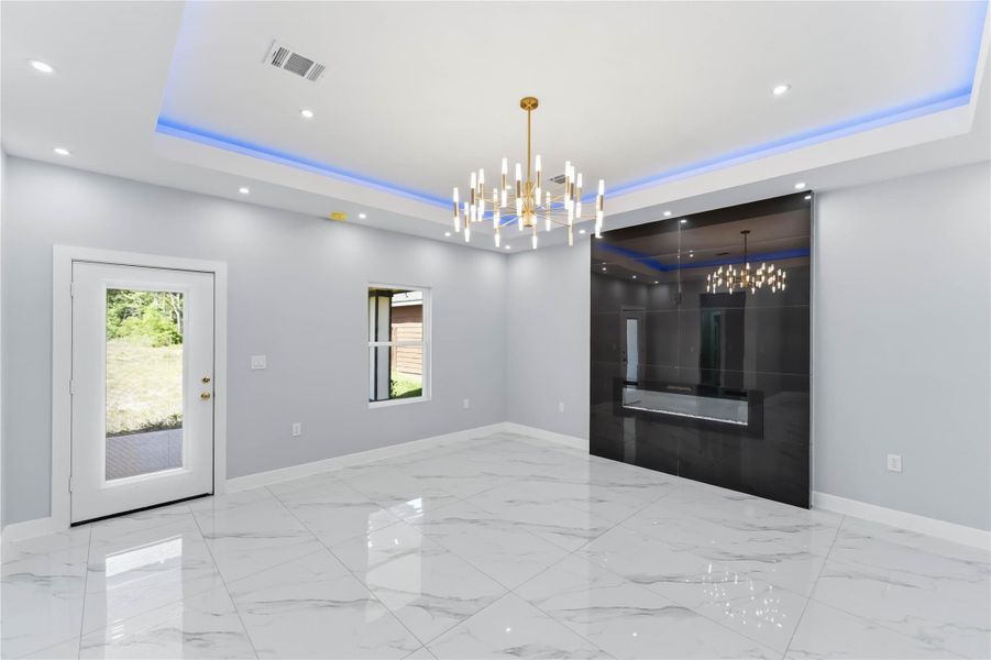 Entry into living, dining kitchen area. Open layout for entertaining