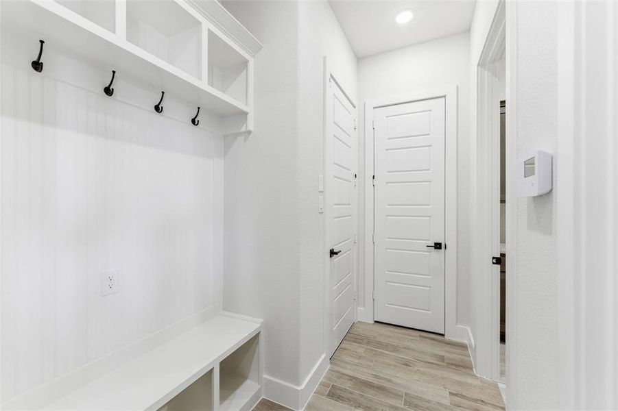 Mudroom with light wood-type flooring