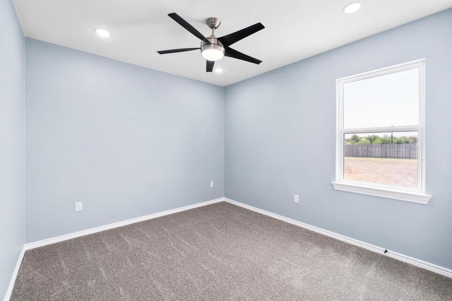 Empty room featuring carpet, ceiling fan, and recessed lighting Empty room featuring carpet, ceiling fan, and recessed lighting