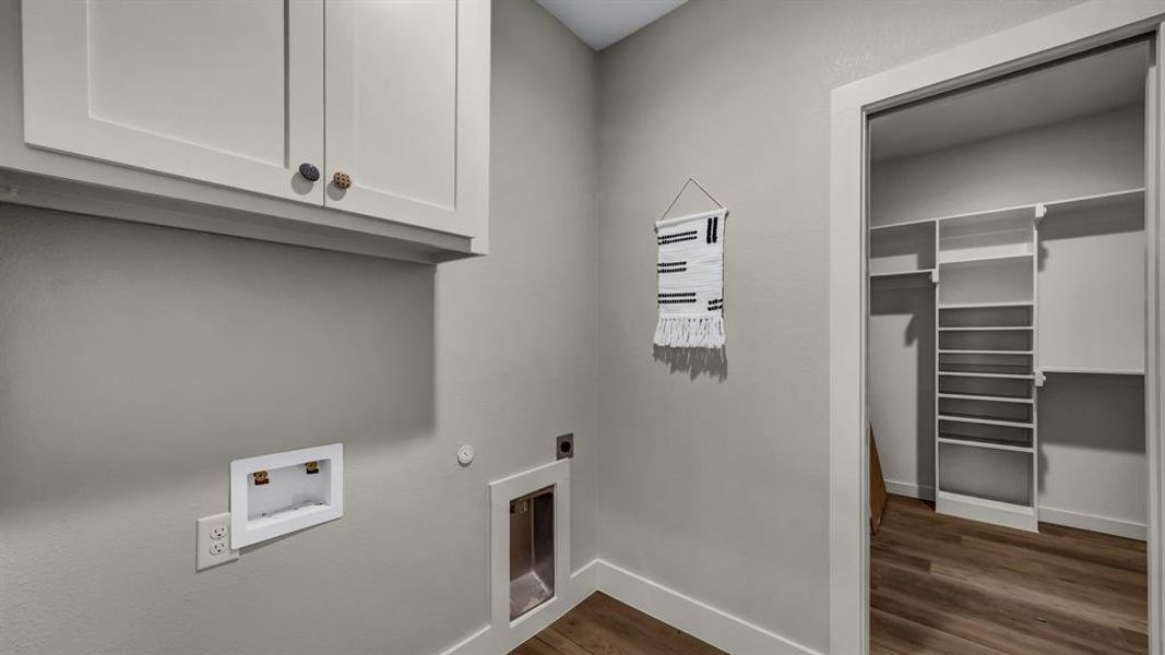 Laundry room connected to the master closet!