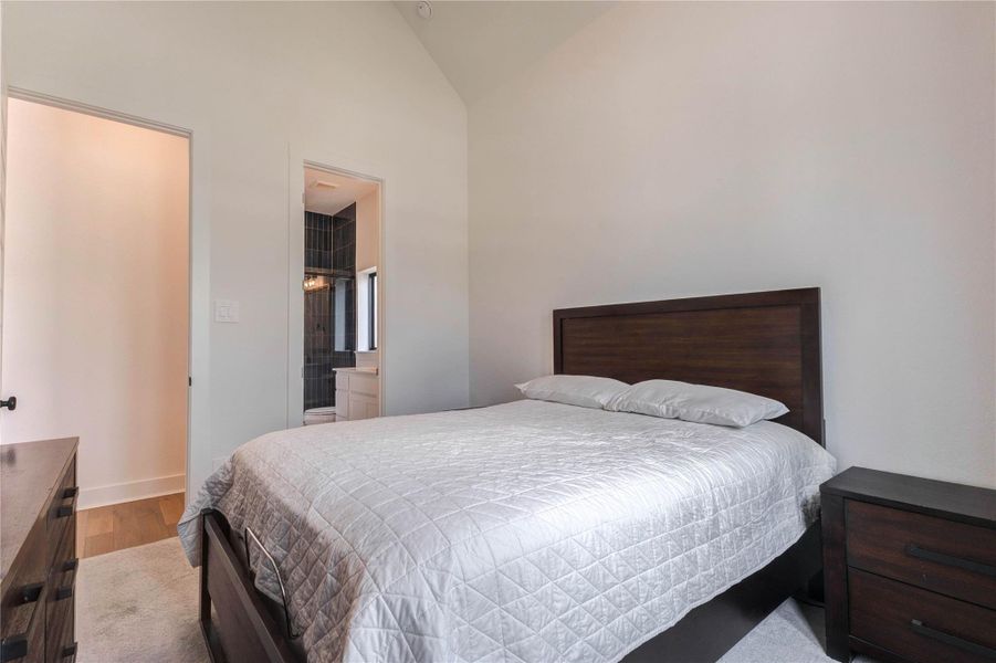 A modern bathroom featuring a sleek glass shower with striking blue tiles and a clean white toilet. Simple and stylish with black hardware accents. A modern bathroom featuring a sleek glass shower with striking blue tiles and a clean white toilet. Simple and stylish with black hardware accents.