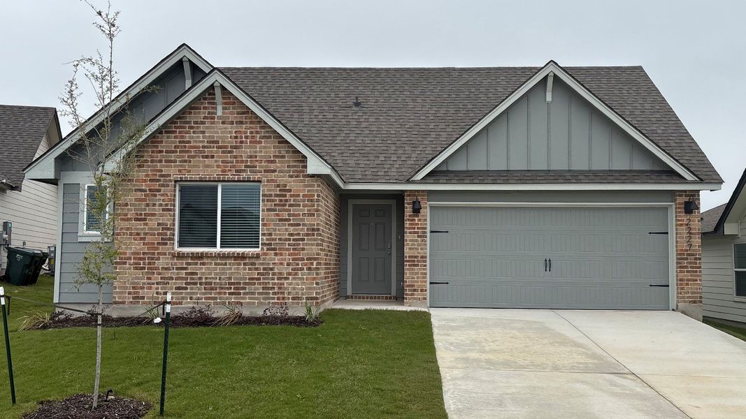 Front exterior of a new home in Oak Ridge, Temple, TX, highlighting curb appeal (Image 1). Front exterior of a new home in Oak Ridge, Temple, TX, highlighting curb appeal (Image 1).