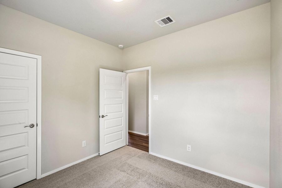 The secondary bedrooms offer comfortable spaces with room to personalize and make your own.