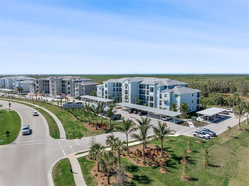Front exterior of a new home in Heritage Landing: Veranda Condominiums, Punta Gorda, FL, highlighting curb appeal (Image 26).