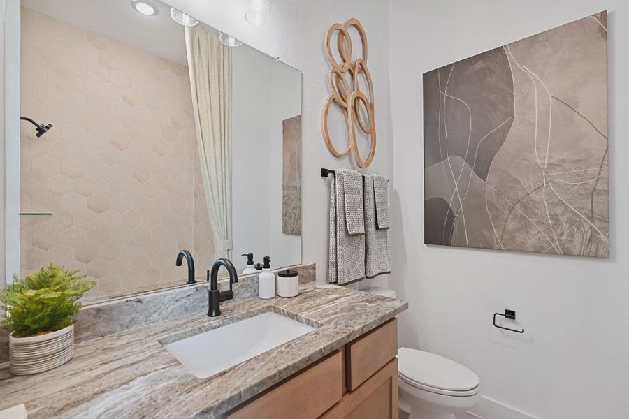 Representative furnished interior of a home built from the Sweetwater by Chesmar Homes in Meridiana 50's and 60's, Manvel (Image 11).