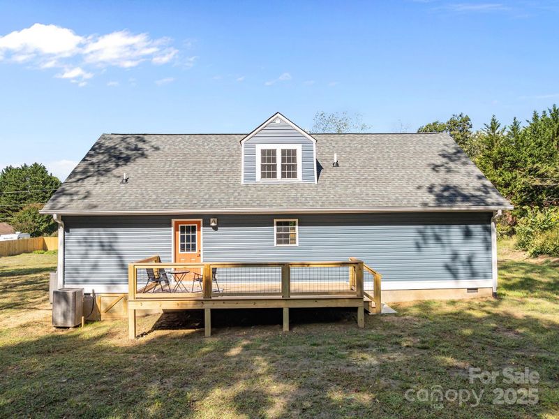 Back of home with deck Back of home with deck