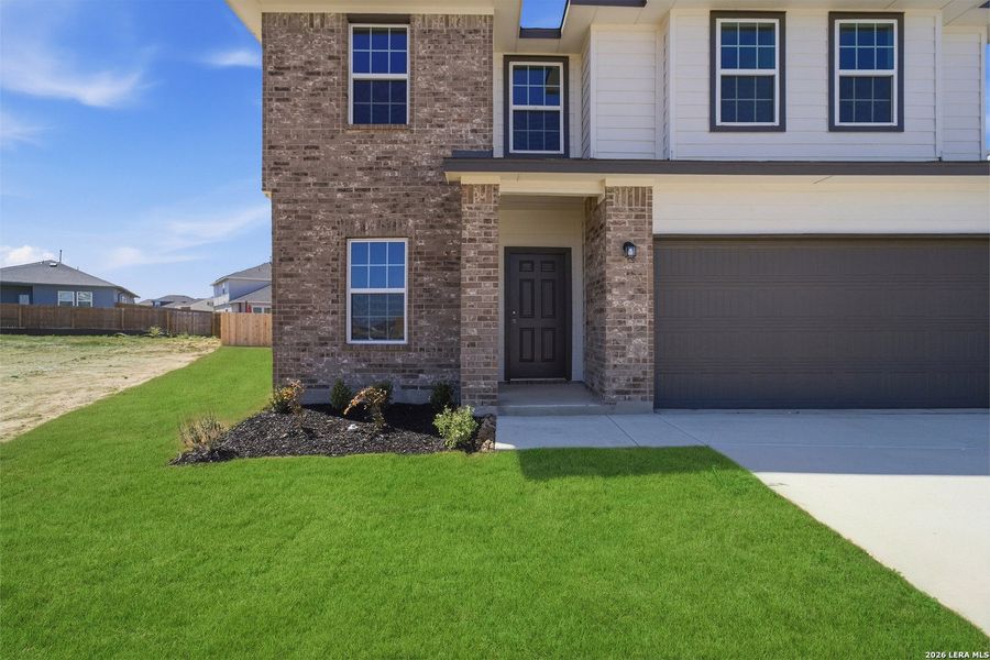 Exterior details and patio area of a home in Hickory Ridge, Elmendorf (Image 3).