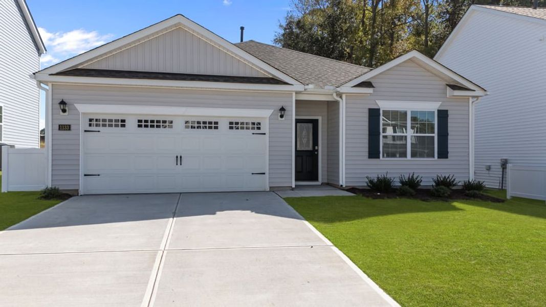 Front exterior of a new home in Saddlebrook, Rocky Mount, NC, highlighting curb appeal (Image 18).