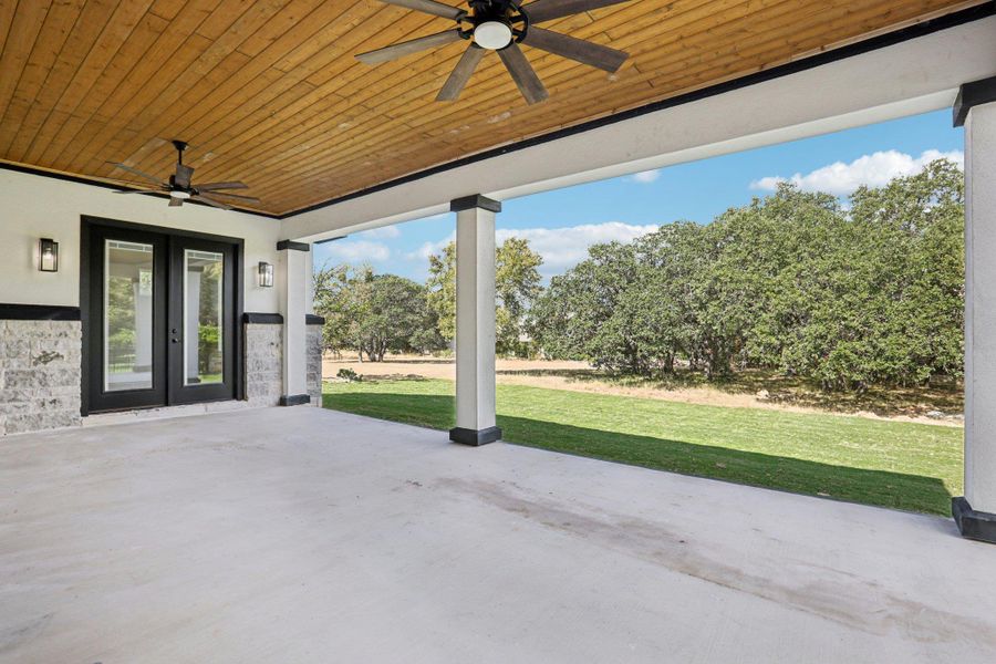 View of patio featuring a ceiling fan and french doors