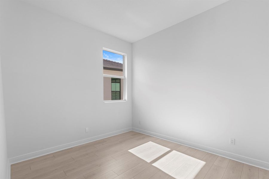 Furnished interior view inside a new home in PGA Village Verano, Port St. Lucie (Image 5).