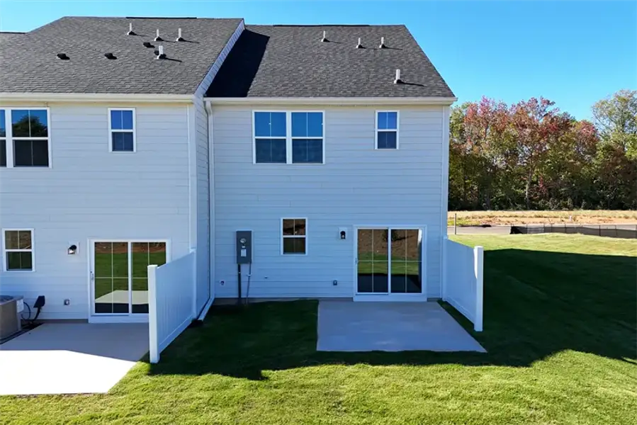 Exterior details and patio area of a home in Townes At Abner Creek, Greer (Image 2).