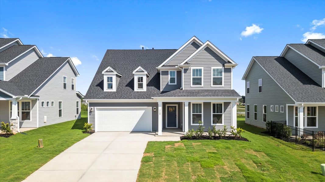 Front exterior of a new home in Foxbank, Gray Court, SC, highlighting curb appeal (Image 2). Front exterior of a new home in Foxbank, Gray Court, SC, highlighting curb appeal (Image 2).