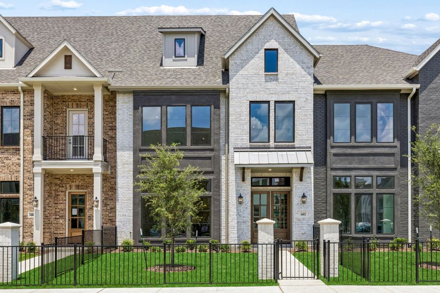 Front exterior of a new home in Newman Village Townhomes, Frisco, TX, highlighting curb appeal (Image 1). Front exterior of a new home in Newman Village Townhomes, Frisco, TX, highlighting curb appeal (Image 1).