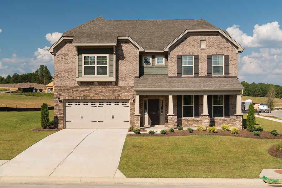 Representative exterior photo of a completed home built from the Yates - Vanguard Collection by Mungo Homes in Georgias Landing, Raleigh, NC (Image 29).