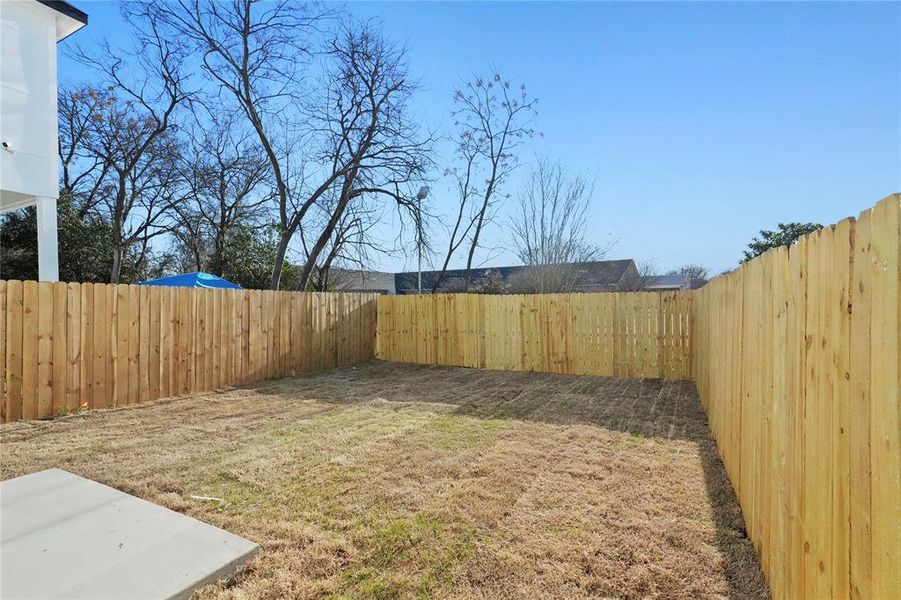 View of fenced backyard