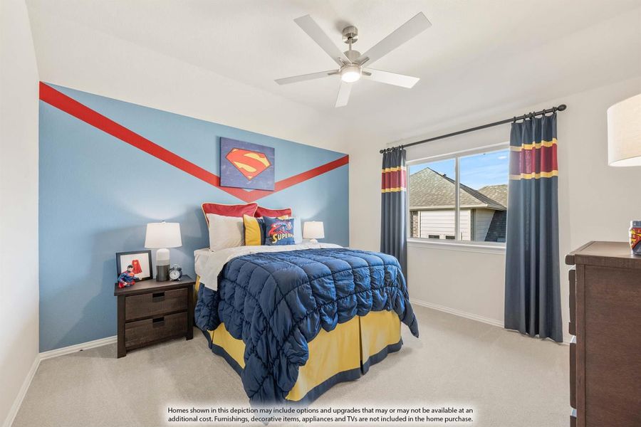 Children's bedroom with Superman-themed blue accent wall, ceiling fan, and carpet flooring