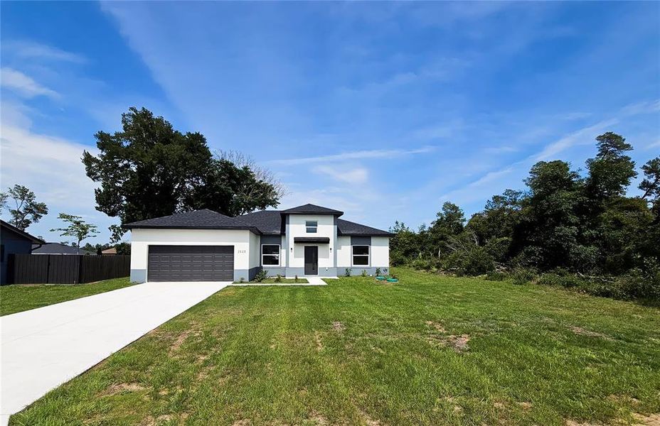 Front exterior of a new home in , Ocala, FL, highlighting curb appeal (Image 2).