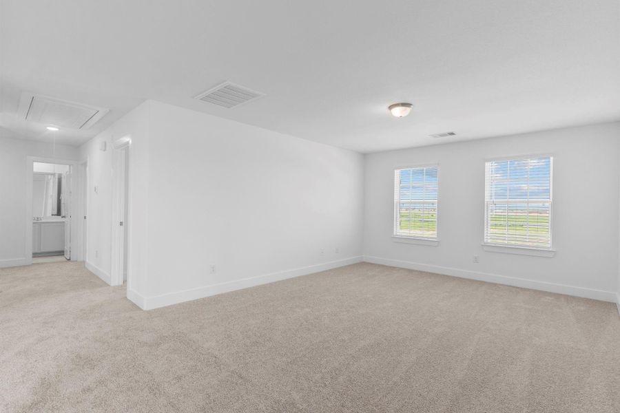 Alternate view of the game room showcasing its seamless access to the upstairs bedrooms, bathroom, and open loft railing. **Image Representative of Plan Only and May Vary as Built**.